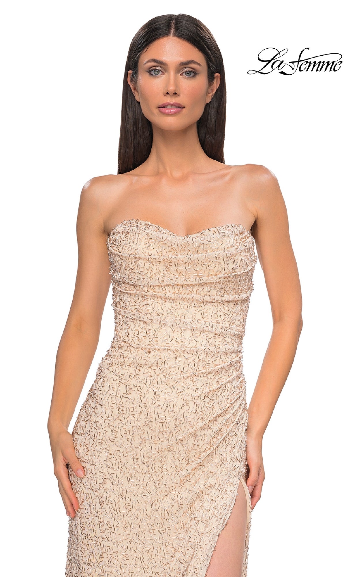 A woman wears the Beaded Long Champagne Prom Dress: La Femme 32794, featuring a strapless design and thigh-high slit, standing against a white background. The La Femme logo is shown in the top right corner.